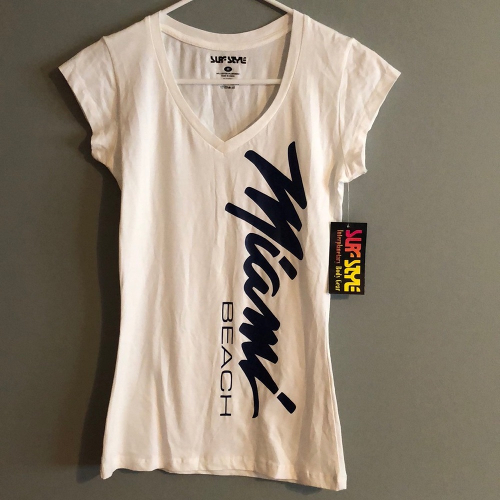 BRAND NEW WOMANS SHIRT SIZE MEDIUM. NEW WITH TAGS ON IT. SMOKE FREE HOME.